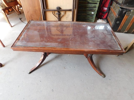 Glass top mahogany coffee table