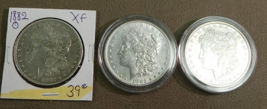 Three 1882 Morgan Silver dollar coins