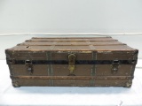 Antique Marshall Field trunk in rough shape.