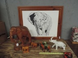 Signed print and wooden elephants.