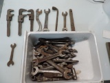Forty end wrenches and 3 adjustable.
