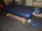 Blue Oakwork performalift massage table.
