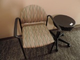 Adjustable height stool and upholstered chair.