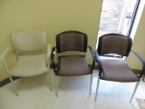 Three upholstered chairs.