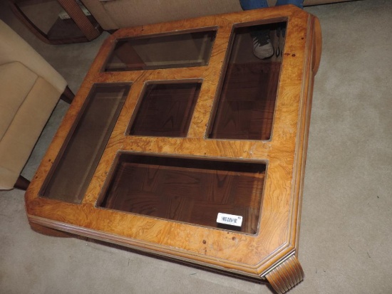 Four piece glass top coffee table set.