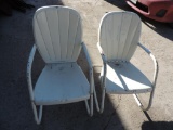 Pair of vintage cream colored metal rockers.