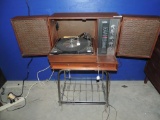 Beautiful mid century table top record player stereo with stand.
