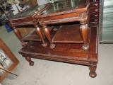 Three piece glass top coffee table set.