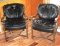 Two Leather Chairs with Ornate Carved Wood Arms