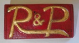 R P Cast Metal Badge