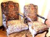 Two Carved Wing Back Chairs