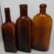 Three Antique Amber Bottles