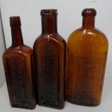 Three Antique Amber Bottles
