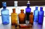Nine Antique Poison and Worm Killer Bottles