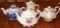 Three Beautiful Floral Porcelain Teapots and Small Pitcher
