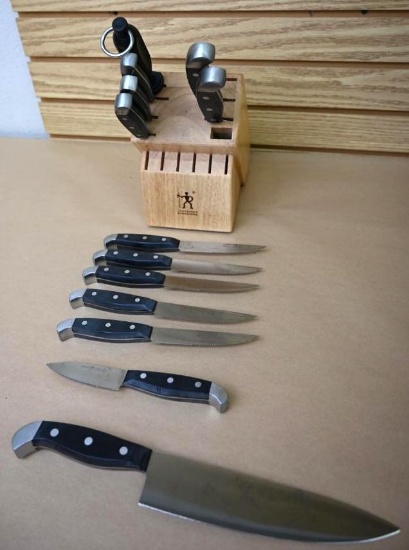Thirteen J. A. Henckels Knives with Block
