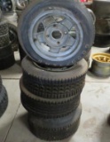 Four Aluminum Four Hole Rims and Tires