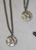 Pair of Sterling Marked St. Francis Pendants on Chains and Crosses
