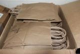 Box Filled with Brown Paper Handled Gift Bags