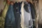 Rolling Garment Rack Filled with Men's Coats