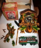 Wood German Cuckoo Clock by GM Anger, Table Top Jukebox, and Tin Trolley Toy