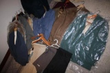 Many Men's Suit Jackets with Some Pants and Flannels