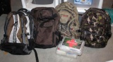 Four Camo or Similar Camping Backpacks and Two First Aid Kits