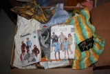 Pile of Mixed Sewing Supplies Including Vintage Fabrics and Patterns