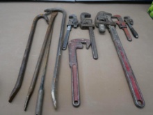 Four Pry Bars & Six Pipe Wrenches