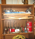 oil cans, contents of shelf