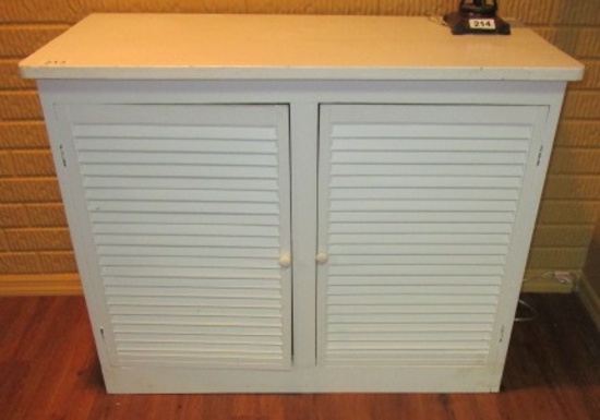 WHITE CABINET WITH LOUVERED DOORS