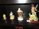 4 bird statues