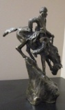 Bronze bucking bronco statue