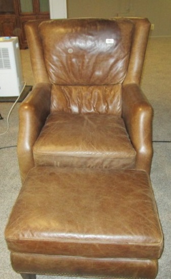 brown leather chair and ottoman