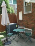 outdoor table, 3 chairs, and umbrella and stand
