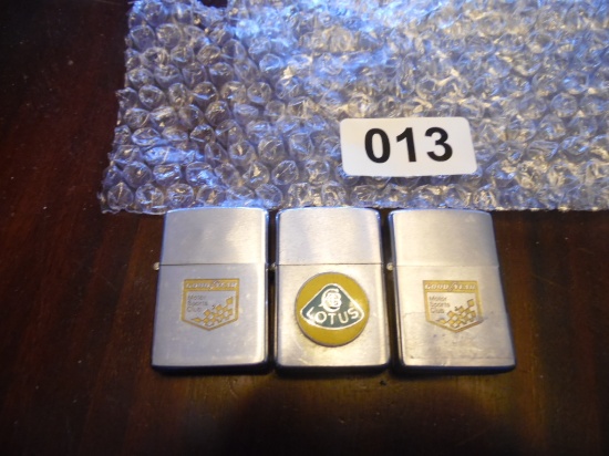 3 Zippo lighters, Goodyear, Lotus, and Goodyear