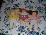 Three Cabbage Patch dolls