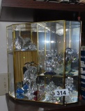 cabinet with crystal figurines