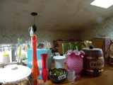 Group of items on top of cabinet, dishes