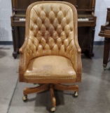 Button Tufted Rustic Leather Swivel Arm Chair