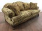 Footed Floral Upholstered Roll Arm Sofa